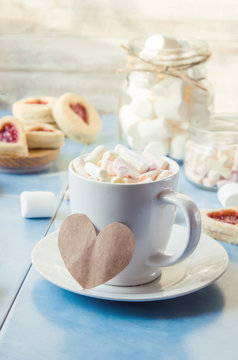 cocoa with marshmallows and a cookie heart. Selective focus.  