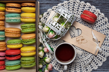 Macaroons in a box on a table. Top view