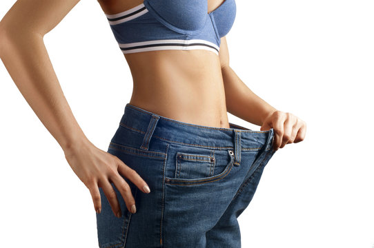Weight loss, diet concept. Thin woman in big pants