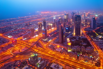 Night Dubai city from the skyscraper Burj Khalifa. At the top. 