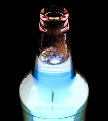 open bottle of beer on a white background