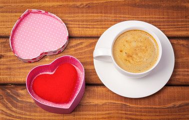 Cup of coffee and heart on the box