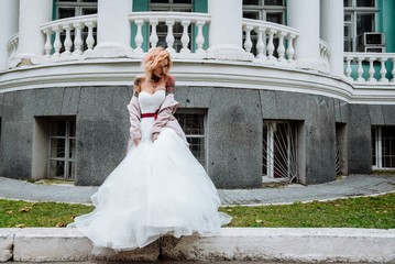 Beautiful bride with tattoo at wedding morning