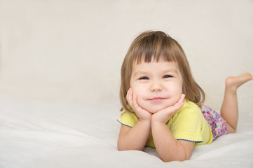 smiling happy little girl portrait with cute cheeks isolated