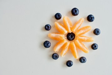 Mandarine and blueberry flower