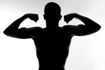 Fototapeta na wymiar silhouette of a man with muscles