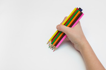 Women's right hand draws a dozen pencils
