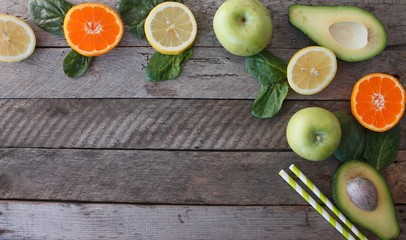 Various citrus fruits on a wooden surface. Fruit food background. Healthy eating and diet.