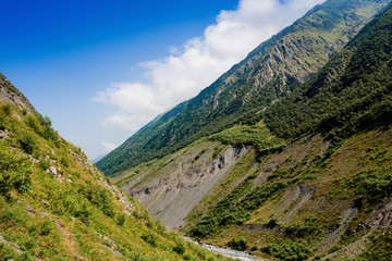 Fototapeta na wymiar Clouds and mountains, Caucas Mountains, Karmadon