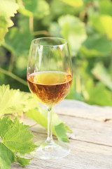 Wine in glass on grey wooden table