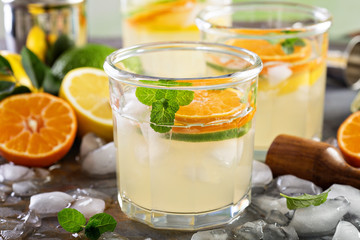 Refreshing summer cocktail with citrus fruits