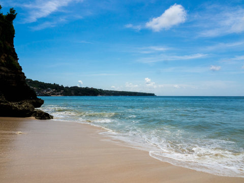 Dreamland Beach, Bali, 2016. It's one of Bali tourist attractions, beautiful beach with white sand and leaned on a steep of white stone cliff overlooking to the amazing view of Indian Ocean. 