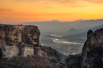 Breathtaking view of Meteora Agiou Stefanou Monastery at sunset, Greece. Geological formations of big rocks with Monasteries  on top of them.