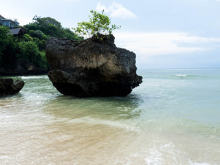 Padang–Padang Beach is one of famous surf point in Bali with the great waves and white sandy. The beautiful beach has white stone hill with nature scenery to the Indian Ocean. 