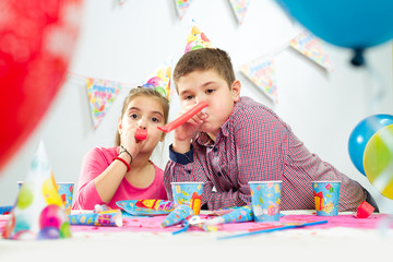 Fototapeta premium Happy group of children having fun at birthday party