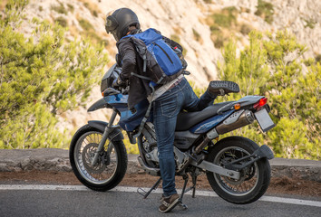 Obraz na płótnie Canvas Tourist using motorcycle in mountains.