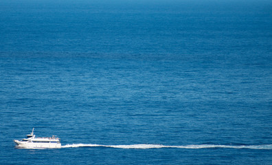 Peaceful ocean landscape with touristic ship.