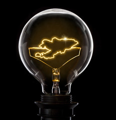 Lightbulb with a glowing wire in the shape of Kyrgyzstan (series)