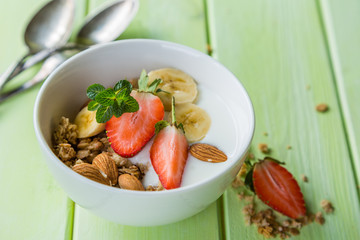 Breakfast - strawberry and banana muesli with yogurt