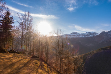 Mountain landscape and chalet in sunlight