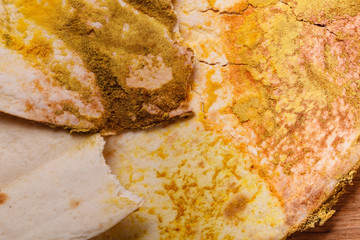 Rotten bread on table.