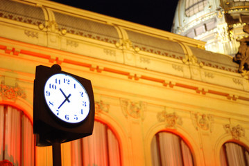 Clock in front of old building