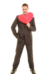 Flirting man in suit holding heart love symbol