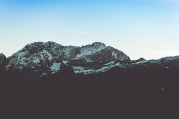 Mountain landscape silhouette at dusk in winter