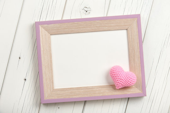 Pink crochet heart and blank wooden frame