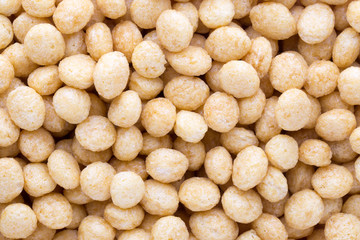 Corn flakes rings on the background.