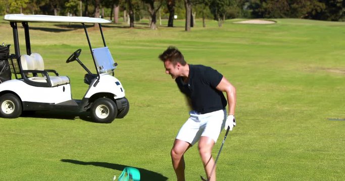Golfer playing golf at golf course 4k