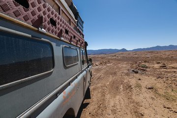 Four by 4 oldtimer driving off road in Morocco