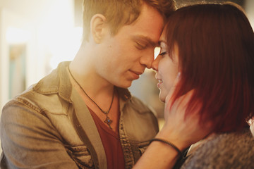 Romantic couple touching and kissing each other