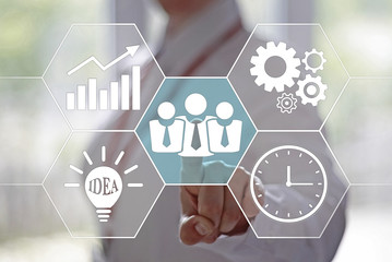 Business, finance, technology and internet concept - businesswoman pressing a group of businessman button on virtual screens. Business group on a touch screen interface. Time management in business. 