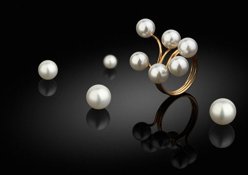 jewelry piece, ring with pearls on black background