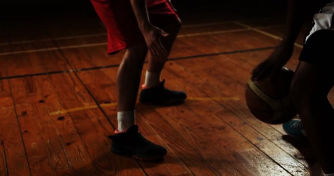 Sportsmen tackling for basketball in basketball court 4k