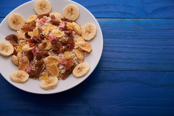 flakes with dried fruit, granola on the plate