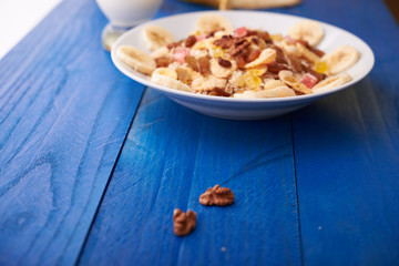 flakes with dried fruit, granola on the plate