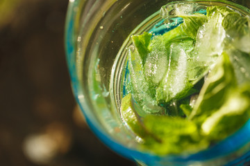Cool refreshing drink on the background of nature