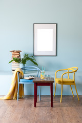 blue room interior concept with frame and colourful metal chairs