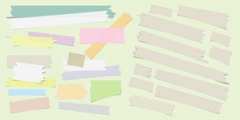 Multiple pieces of colorful and beige sticky tape in different shapes on light background - 134525704