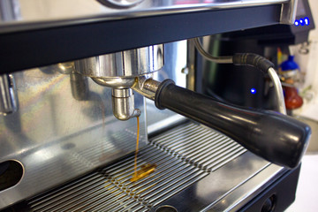 Fototapeta na wymiar coffee running from the coffee machine