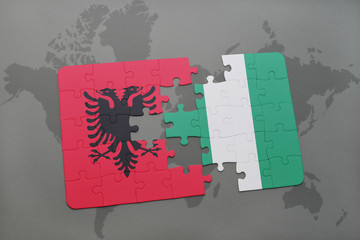 puzzle with the national flag of albania and nigeria on a world map