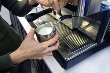 coffee machine beating milk