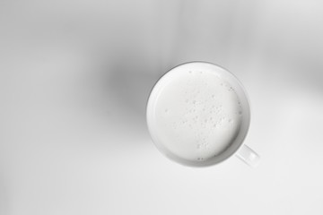 top view of glass milk / Glass of Milk From Above / gray tone