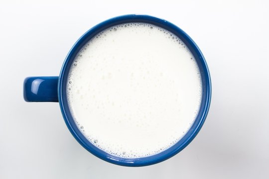 top view of glass milk / Blue glass of Milk From Above / gray tone