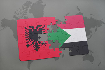 puzzle with the national flag of albania and sudan on a world map