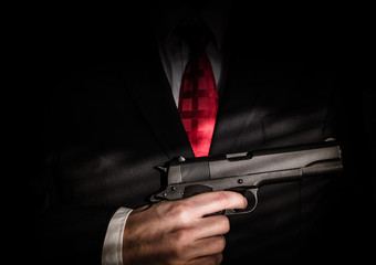 Mafioso in suit with a gun - obrazy, fototapety, plakaty