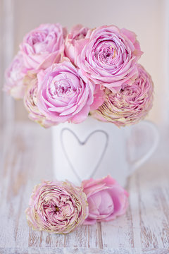 Lovely bunch of flowers .Close-up floral composition with a pink roses .Many beautiful fresh pink roses on a table. 