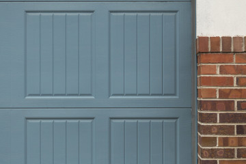 Blue Garage Door with Brick Border